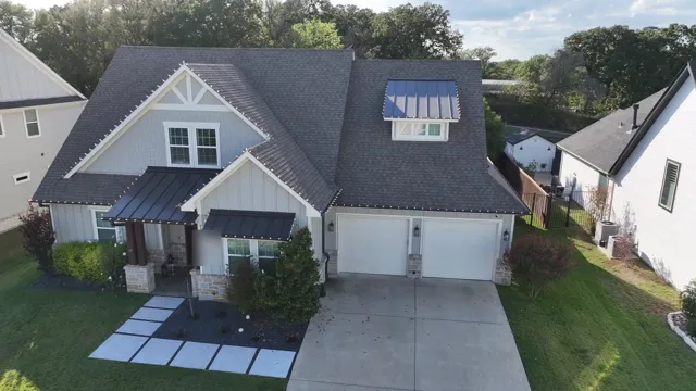 Aerial view of a home with holiday lights